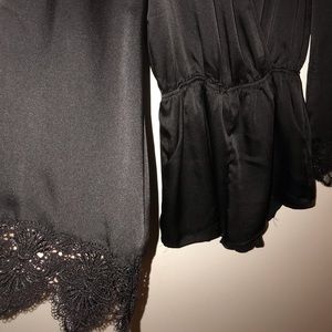 STELLA black romper with lace accent